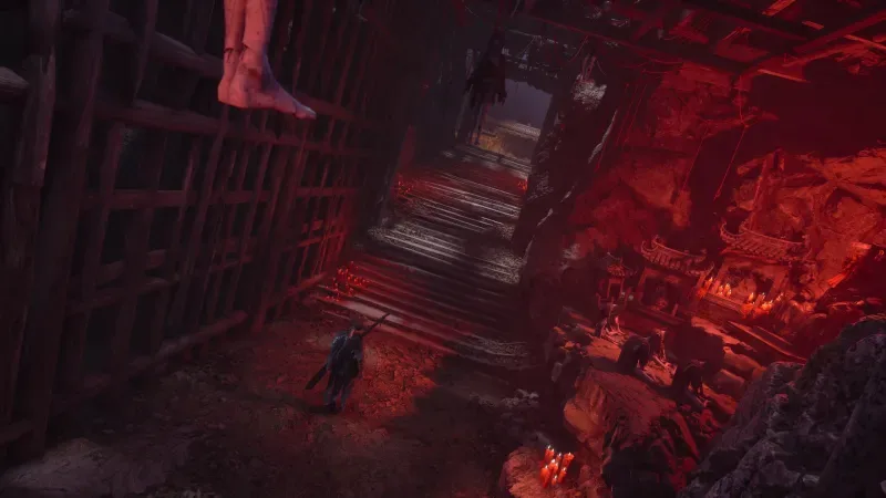 Phantom Blade Zero sötét, vörösen megvilágított barlangszerű folyosója